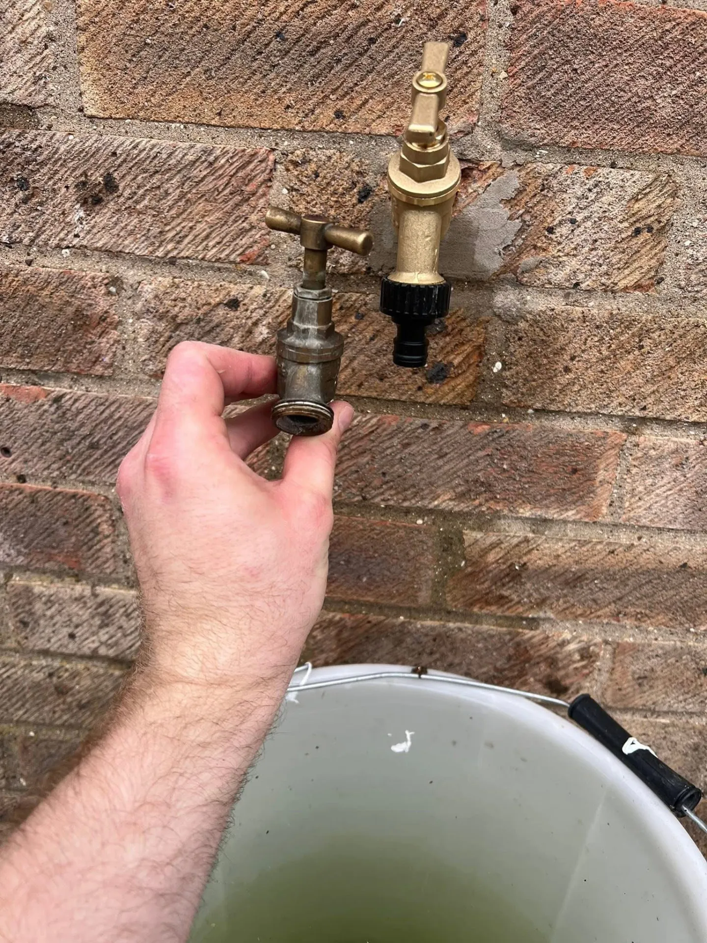 Old outside tap removed and replaced with a new brass outdoor tap